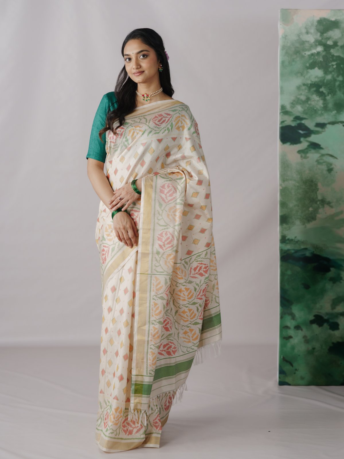 Off - White Patola Silk Saree with Gold Zari Border