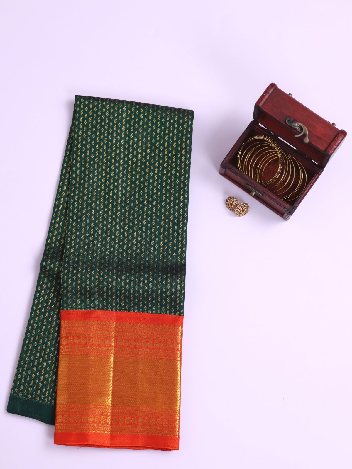 Bottle Green Kanjeevaram Silk Pavadai With Reddish Orange Border