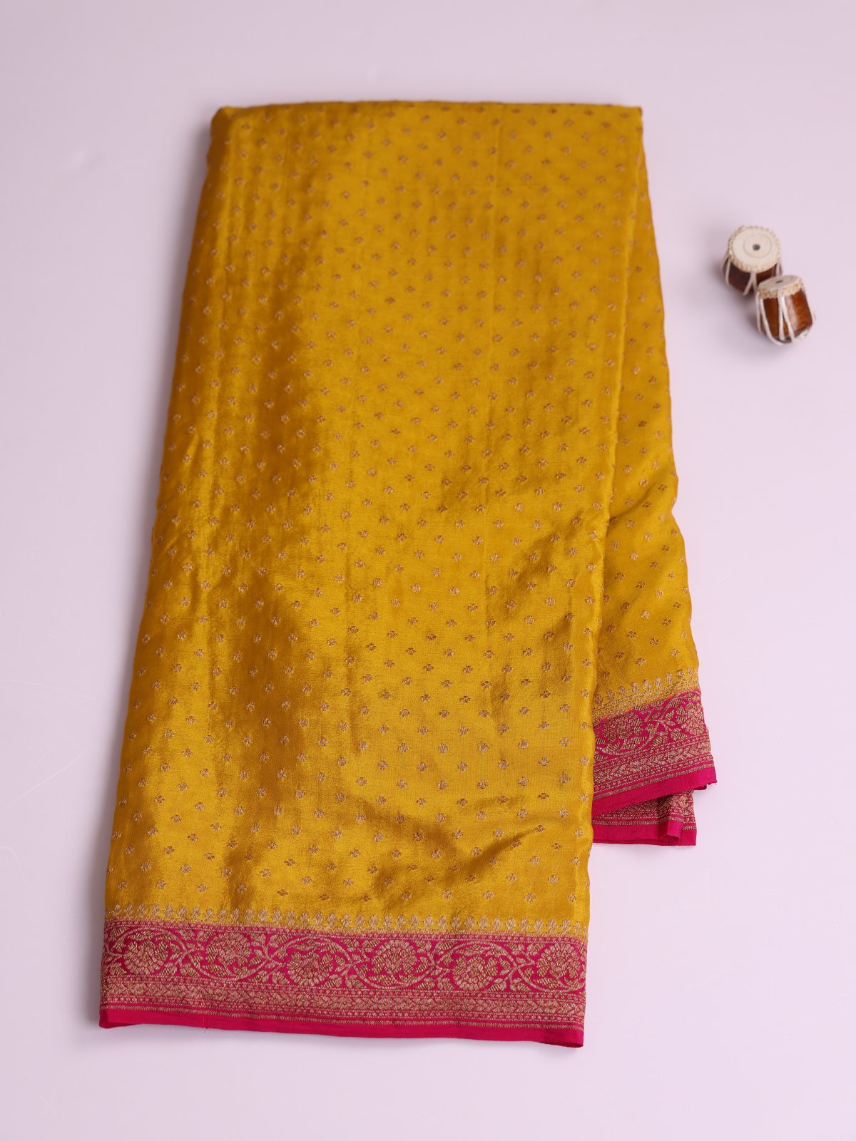 Mustard Yellow Banaras Crepe Silk Saree With Rani Pink Border
