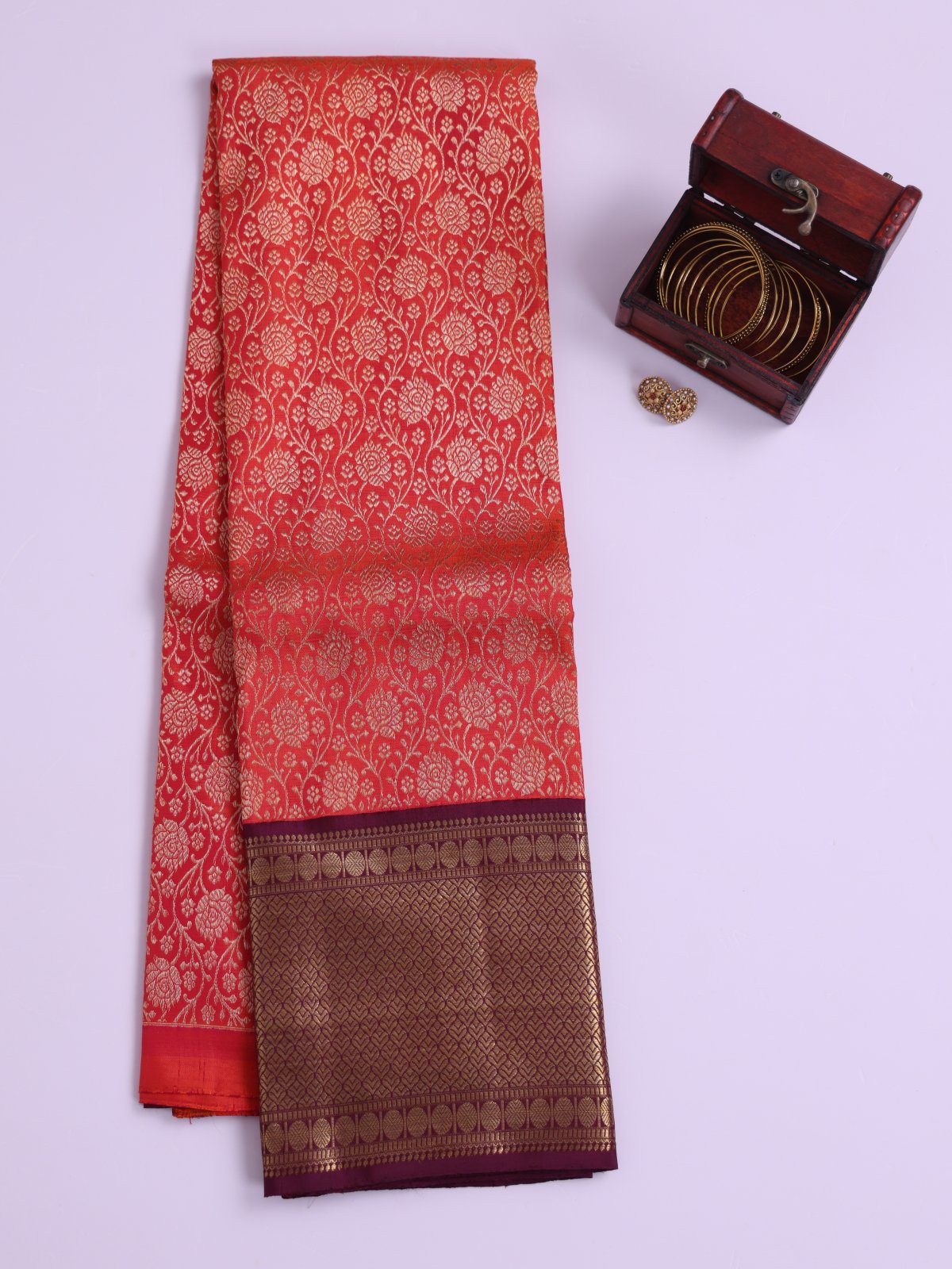 Pinkish Orange Kanjeevaram Silk Pavadai With Dark Purple Border