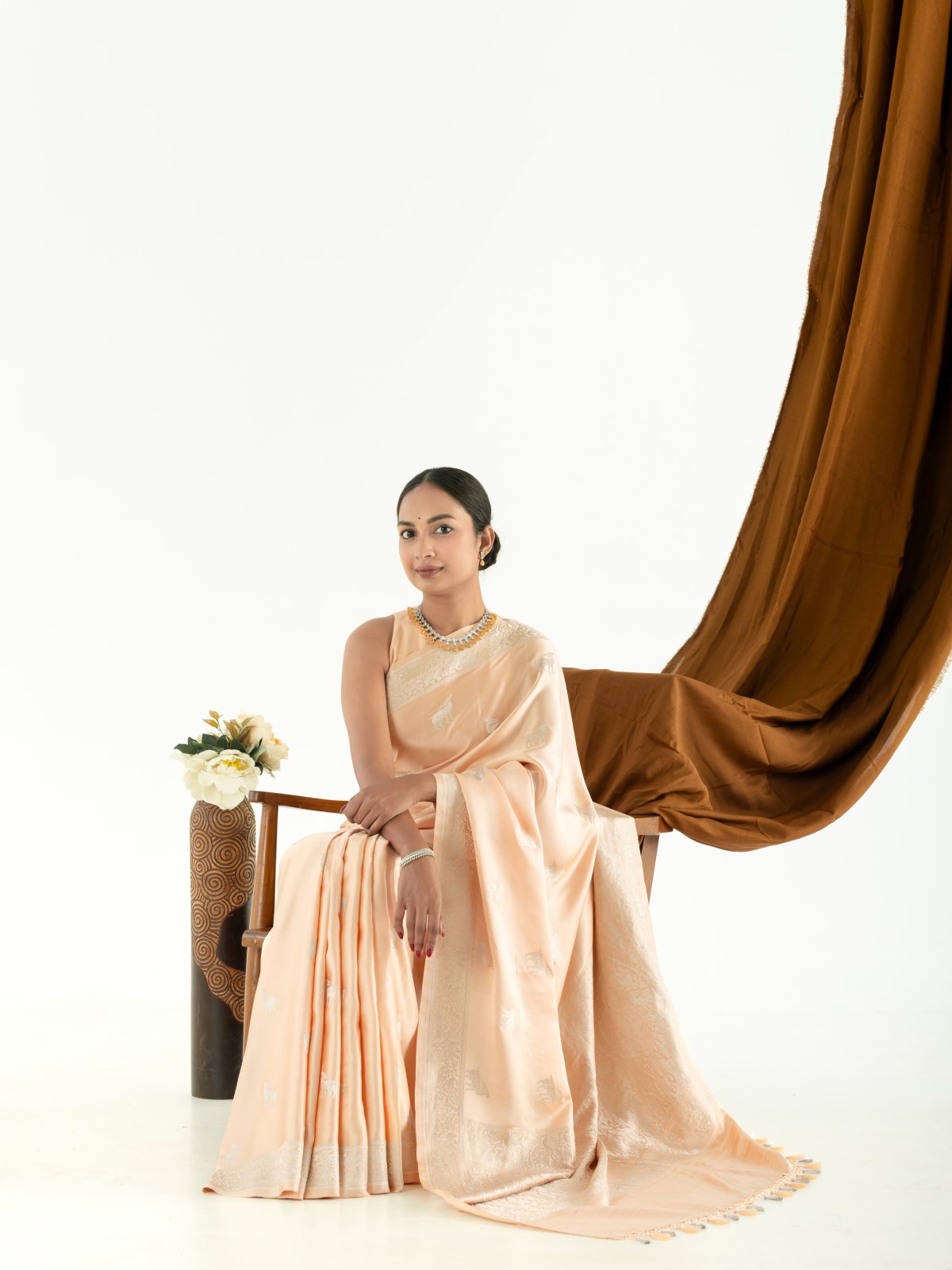 Light Peach Mashru Silk Saree with Self Zari Border