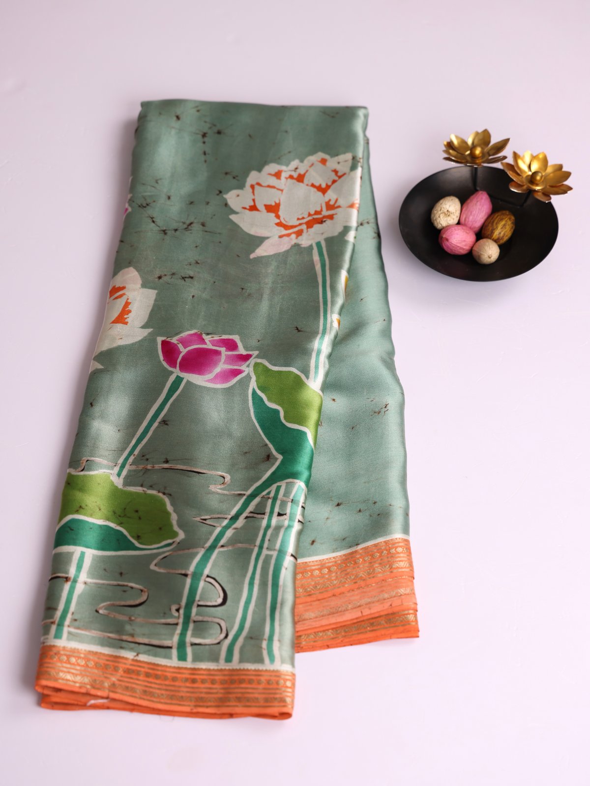 Sage Green Batik Printed Satin Silk Saree With Orange Zari Border
