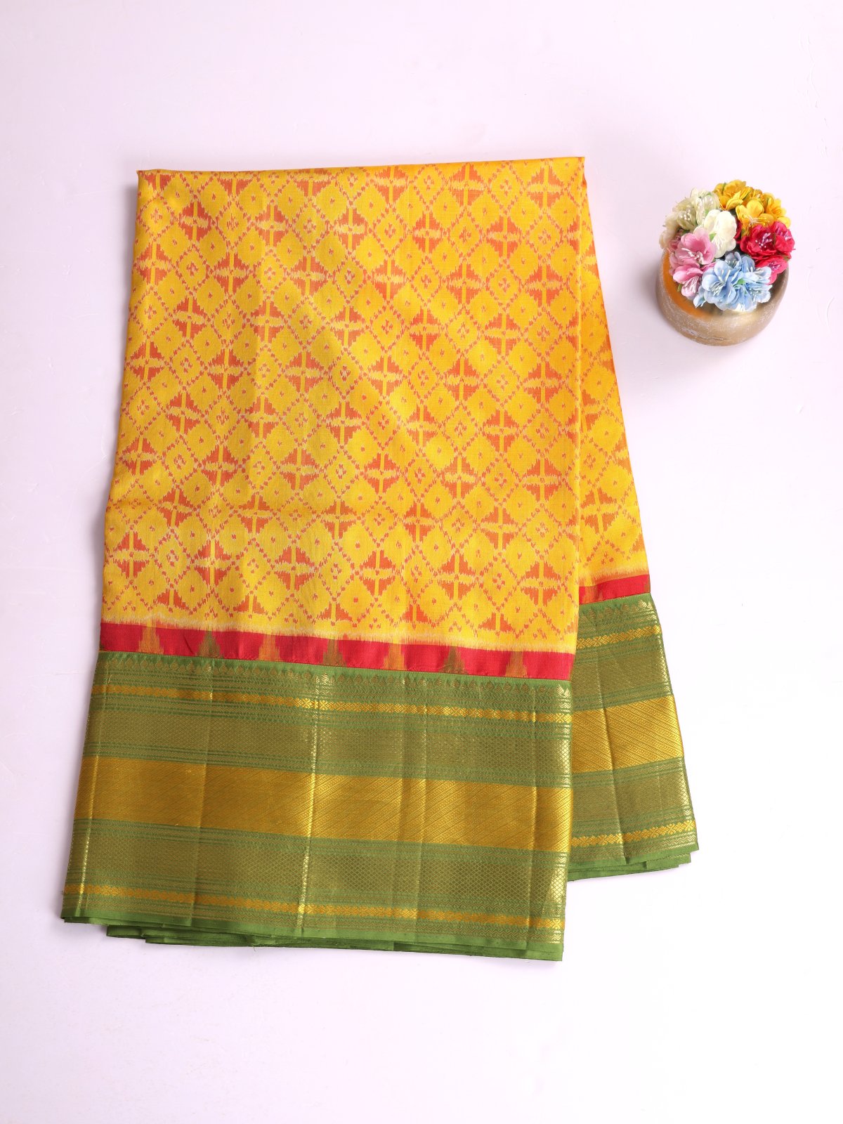 Mustard Yellow Patola Silk Saree With Mehndi Green Kanjeevaram Zari Border