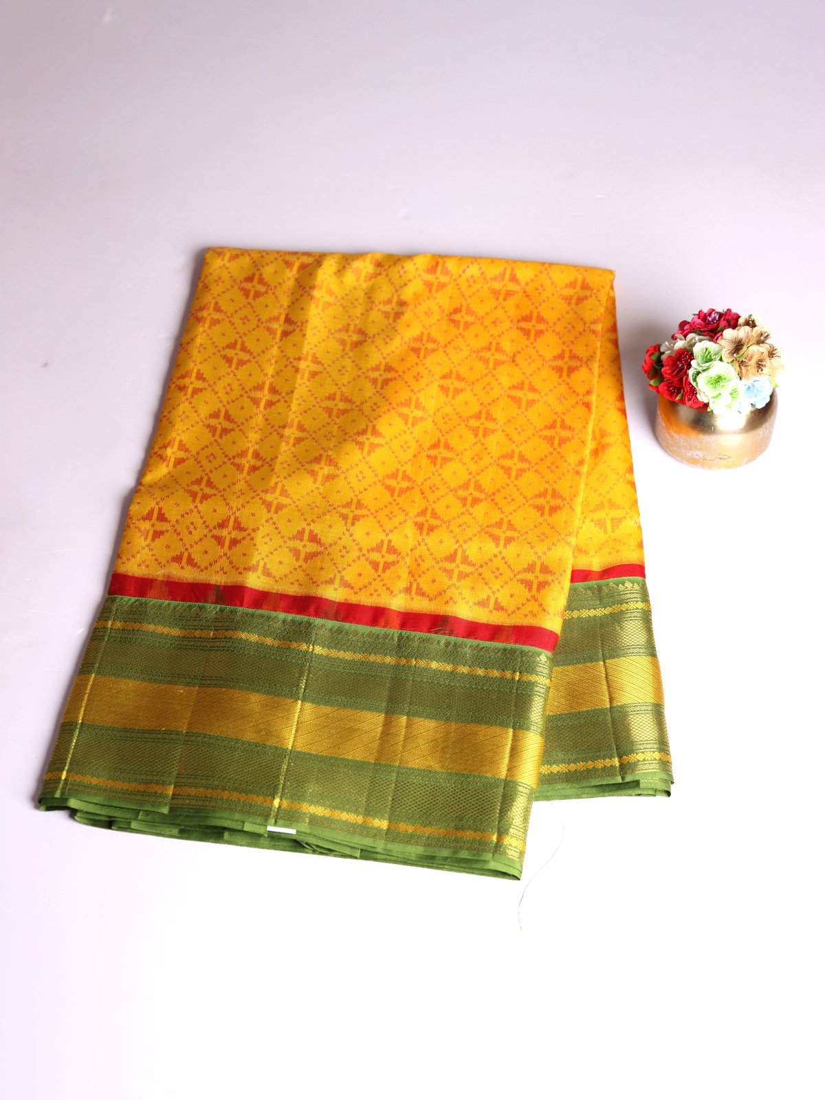 Mustard Yellow Patola Silk Saree With Mehndi Green Kanjeevaram Zari Border