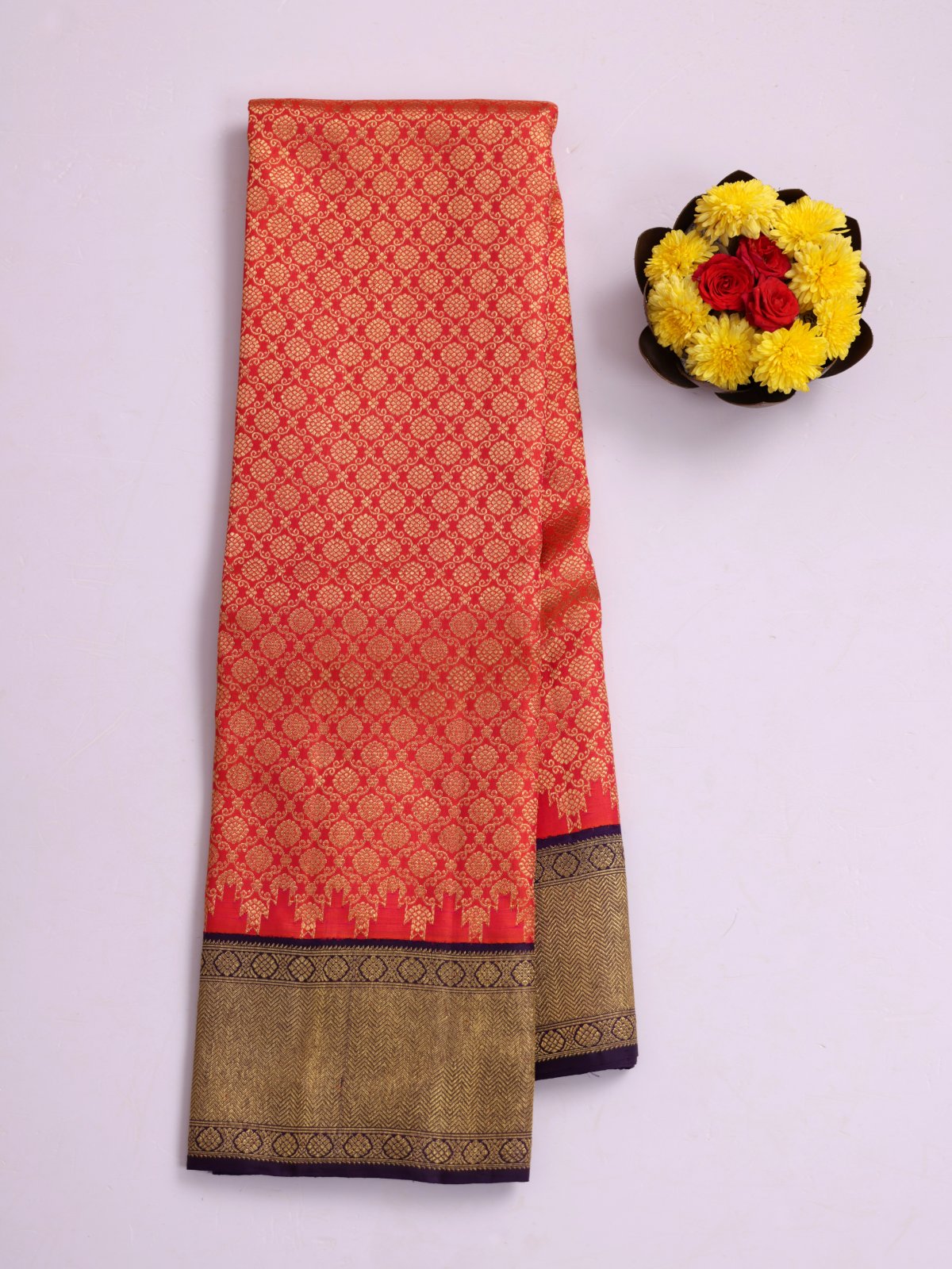 Pinkish Orange Zari Brocade Kanjeevaram Silk Saree With Purplish Blue Border