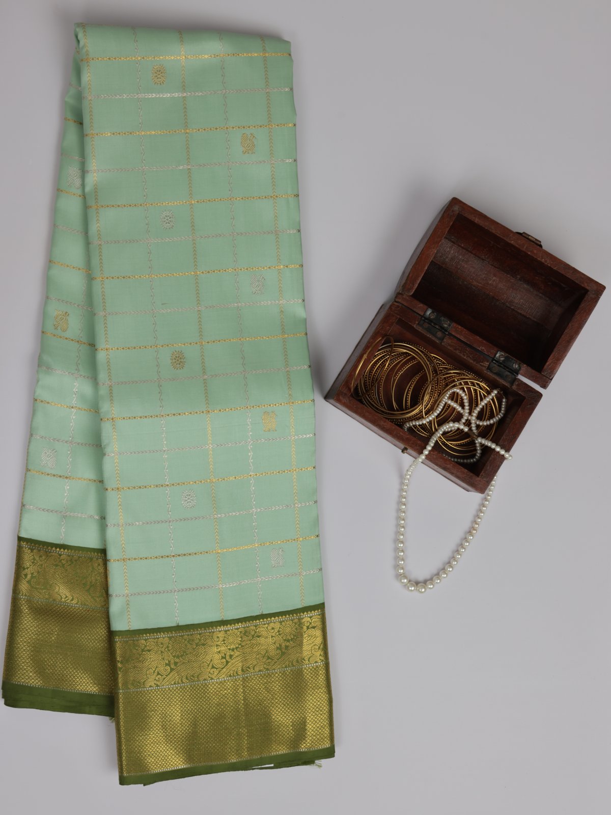 Pastel Pista Green Zari Checked Kanjeevaram Silk Saree With Mehandi Green Border