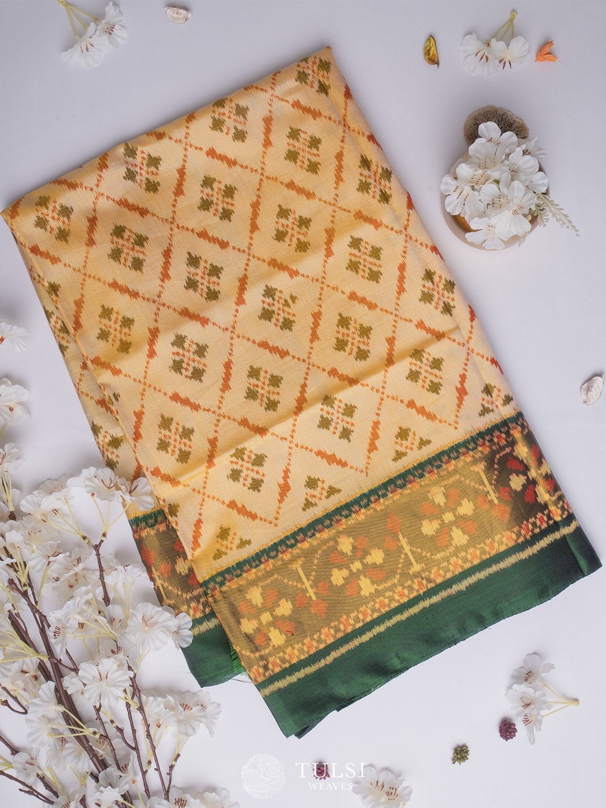 Beige Patola Silk Saree with Green tissue border