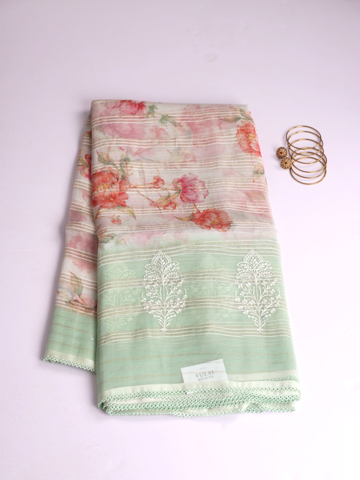 Off White Printed Organza Silk Saree With Pastel Green Embroidered Border