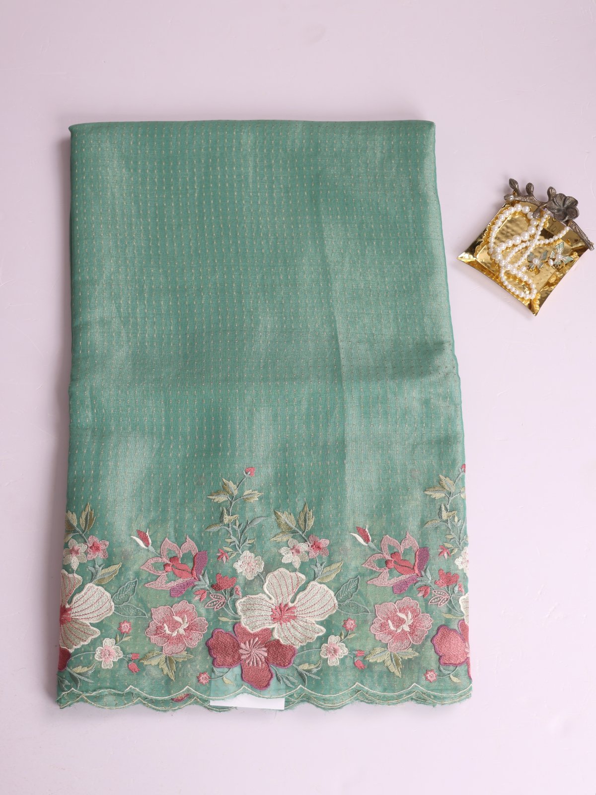 Light Bluish Green Tissue Georgette Silk Saree With Embroidered Border