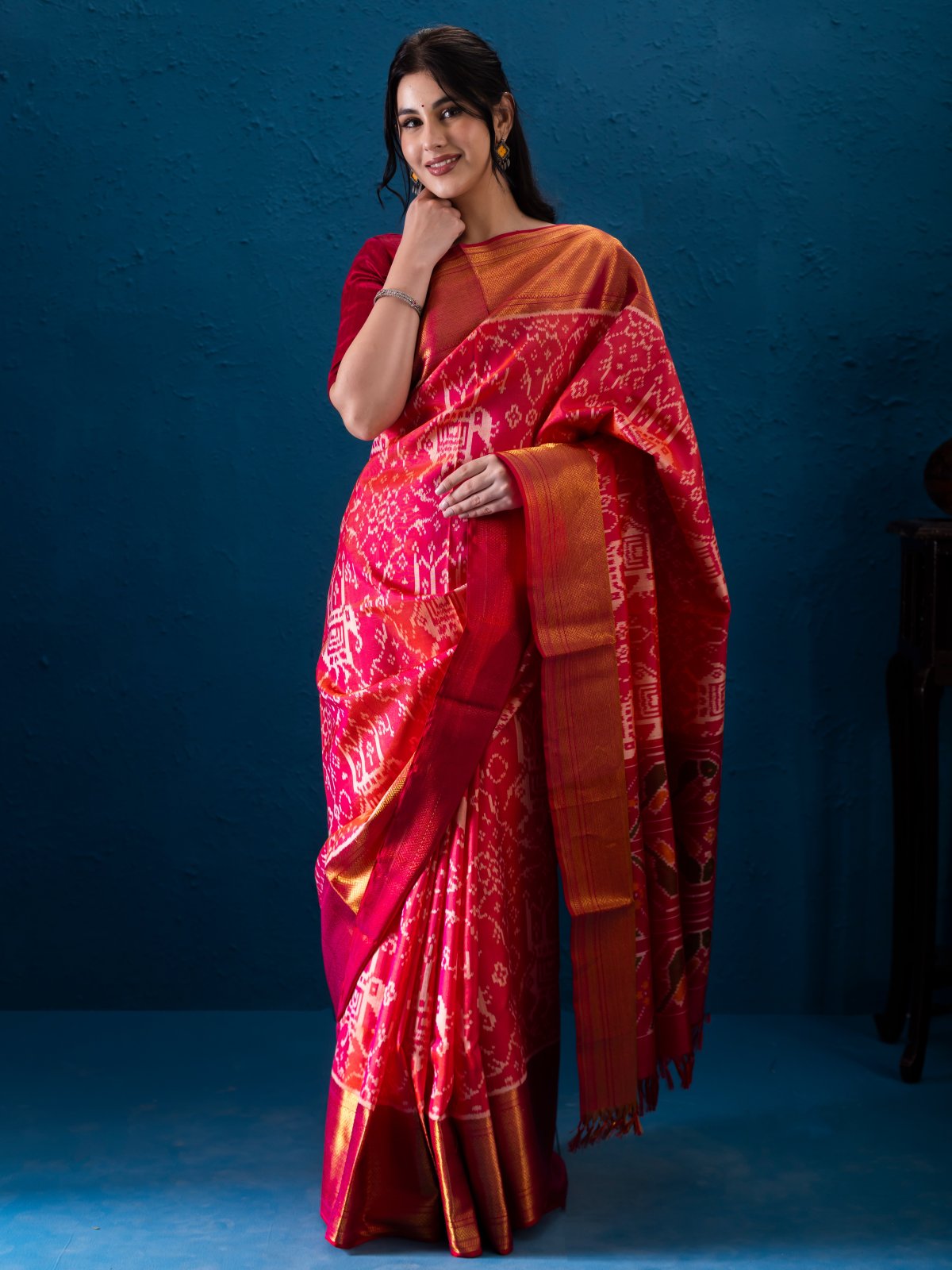 Orangish Pink Patola Silk Saree with Zari Border