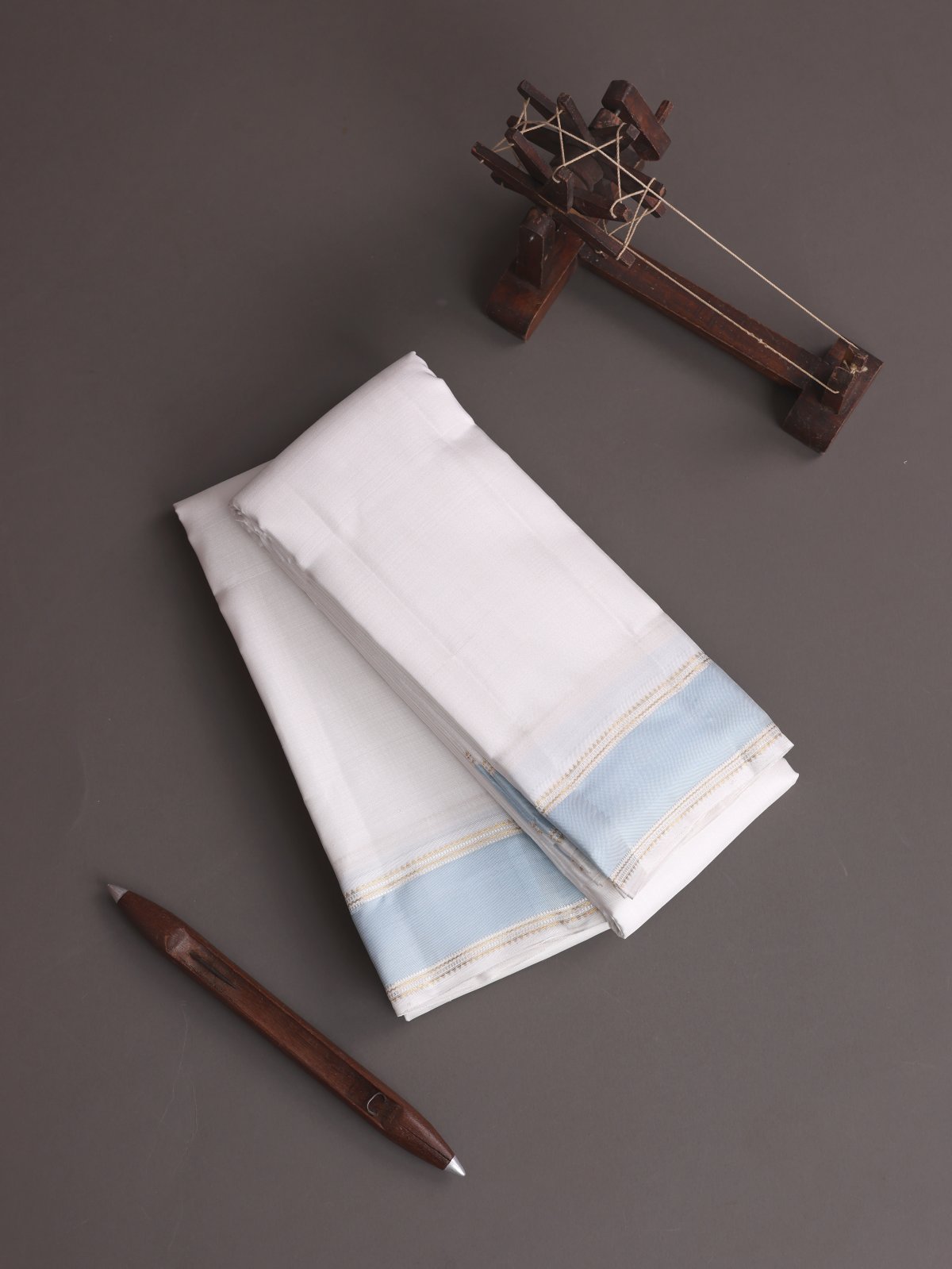 White Silk Dhoti And Vasthram With Light Blue Border 