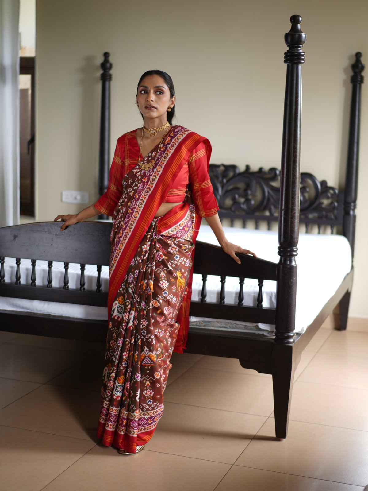 Dark Brown Patan Patola Silk Saree With Red Border 