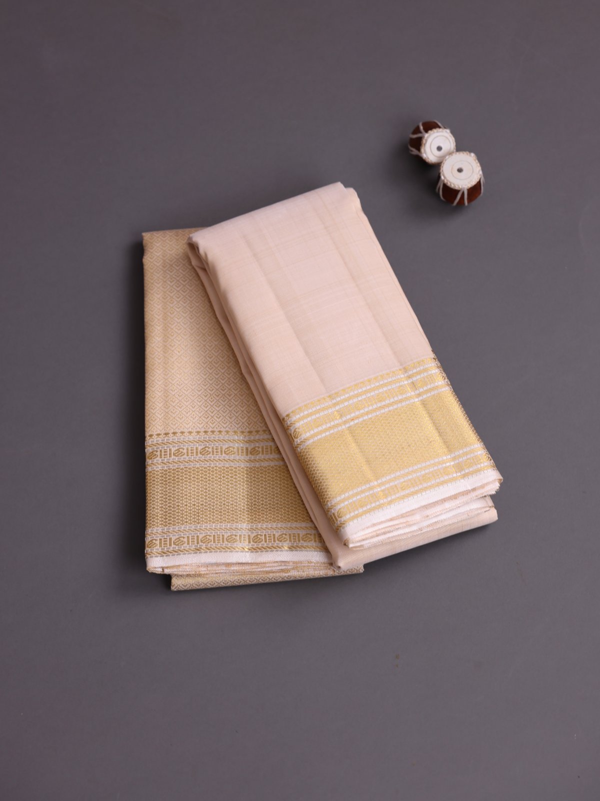 Beige Silk Dhoti and Zari brocade Vasthram with Zari Border